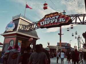 people walking through the giant dipper entrance