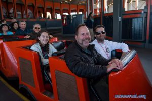 people smiling on park ride
