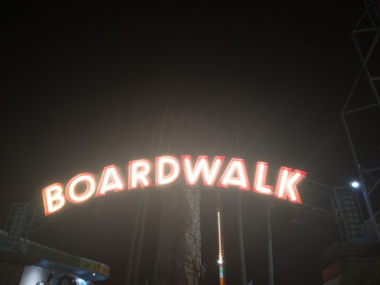 boardwalk sign lit up at night