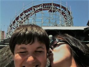 mother and son on amusement park ride